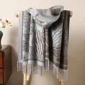 Detailed view of the ethnic pattern texture and long tassels on this thick autumn shawl - Gray