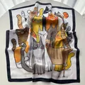 Close-up of a square silk scarf with playful cartoon cat prints and black borders - Black