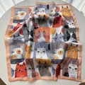 Detail of silk-like square scarf featuring artistic cartoon cat prints and soft textures - Pink