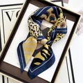 Elegant leopard print silk scarf for women in navy and gold inside a luxury gift box - Blue