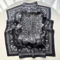 Detail of vintage black and white paisley floral silk scarf with soft silk texture - Black