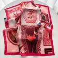 Detail of elegant butterfly and floral print satin scarf on a white circular surface - Pink