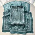 Close-up of vintage floral printed square silk scarf with elegant baroque pattern detail - Malachite green