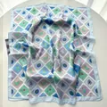 Detailed view of silk square scarf with vintage tropical plant and seashell prints - Blue
