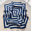 Detailed view of striped satin square scarf with geometric blue and white pattern - Blue