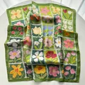 Detailed view of square silk-like scarf with oil painting floral prints and green borders - Green