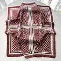 Close-up of dark burgundy polka dot silk scarf with vintage geometric pattern textures - Dark Red