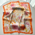 Silky square scarf with vibrant watercolor peony floral print in orange and pink tones - Orange