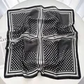 Polished faux silk square scarf featuring black and white polka dots and stripe patterns - Black