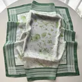 Close-up of green floral bouquet print on luxury striped square silk scarf - Light Green