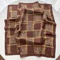 Silk square scarf with vintage leopard print and golden chain pattern on white table - Grid Leopard Pattern