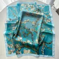 Close-up of sky blue silk scarf featuring blooming almond blossom art on white table - Sky Blue