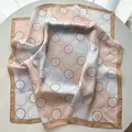 Elegant geometric print silk square scarf with satin finish in beige and pink tones - Khaki