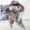 Close-up of elegant silk scarf with tassel prints on a wooden tray with magazines - Retro Pink Blue Grey Color Block Tassel Style (Style 39)