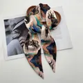 Detail of silk satin scarf with horse and cloud print tied on a wooden tray - Navy Blue & Coral Orange Equestrian Artistic Style (Style 40)
