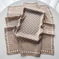 Close-up of champagne gold satin square scarf with elegant white gradient polka dot pattern - 65cmx65cm / Khaki