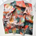 Detailed macro view of floral silk scarf featuring elegant lotus and dragonfly oil painting art - Green