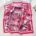 Pink and white silk square scarf featuring tropical monstera leaves and magenta edges - Pink