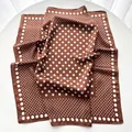 Close-up of brown and white polka dot satin scarf with a smooth silky texture - 65cmx65cm / Bronze