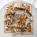 Silk square scarf with tropical monstera leaf print in ginger yellow and caramel hues - Yellow