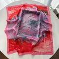 Detailed macro view of the silky square scarf featuring abstract oil painting patterns - Pink