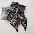 Detail of black silk scarf featuring golden chain and polka dot print in gift box - Black Polka Dot Gold-Tone Chain Style (Style 3)
