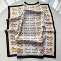 Off-white silk scarf featuring colorful rocking horse prints and black borders - Black