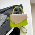 Neon green motor-style underarm bag with beige woven flap and gold metal hardware - Green
