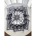 Elegant white square silk scarf featuring a classic black paisley print and satin finish - White