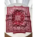 Luxurious deep red square silk scarf featuring white paisley patterns on a satin fabric - Brick Red