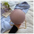 Detail of pink spherical chain bag with woven texture and gold metal chain strap - Pink