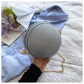 Detail of silver spherical evening bag with glitter woven texture and gold chain strap - Silver