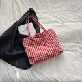 Red and white gingham canvas tote bag with a bow tie detail for daily shoulder use - Red