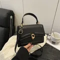 Classic black crossbody bag with gold ring buckle and adjustable strap for women - Black