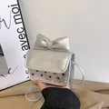 Silver mini crossbody bag with red polka dots and large bow detail for girls - Silver