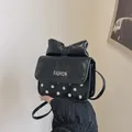 Mini crossbody bag with white polka dots, a large bow detail and FASHION logo - Black