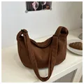 Detail shot of vintage dark brown corduroy shoulder bag with soft textured fabric - Brown
