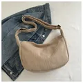 Minimalist beige corduroy crescent shoulder bag with soft textured hobo design - Khaki