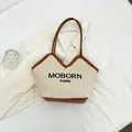 Bolso tote de paja beige con ribete de cuero marrón y logotipo de MOBORN PARIS - Marrón