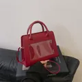 Red matte PU leather crossbody bag with clear window and circular handles in trendy style - Red