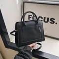 Minimalist black leather purse with clear window and dual handles for women - Black