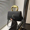 Chic black crossbody bag with acrylic handle and woven texture detail for women - Black