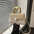 Chic white leather and beige woven crossbody bag with artistic gold handle and strap - White