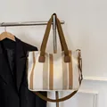 Striped canvas tote bag in beige and coffee brown with dual handles and crossbody strap - Off White