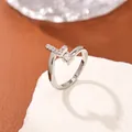 Silver open ring with micro-pave letter L and round zircon on a textured stone base - Letter L Style