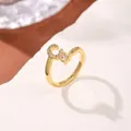 Macro side view of gold-plated copper ring featuring letter C with sparkling zircons - Letter C