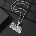 Detailed macro view of silver BANK letter pendant with sparkling cubic zirconia on rope chain - Pendant With Rope Chain / Silver