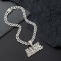 Macro shot of silver hip-hop chain with BANK letter pendant featuring iced out rhinestones - Pendant With Cuban Link Chain / Silver