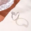 Silver open ring featuring a sparkling zircon-encrusted infinity symbol and single stone - Letter S Style