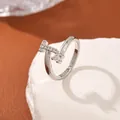 Silver open ring with T-letter element and cubic zirconia in a minimalist style - Letter T Style